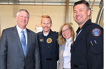 Darcy Davis with David Barbe and two members of the Trauma Hawk flight team.